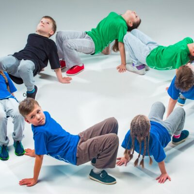 The kids dance school, ballet, hiphop, street, funky and modern dancers on gray studio background